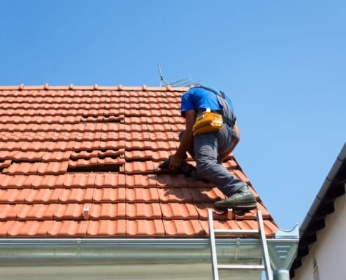 Steve Bennet inspecting a roof in Oklahoma